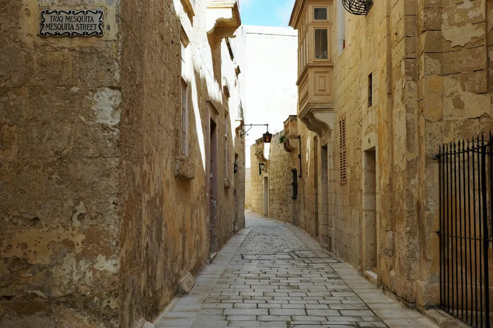 Mesquita Street, a narrow stone lane in Mdina closed to visitors' cars